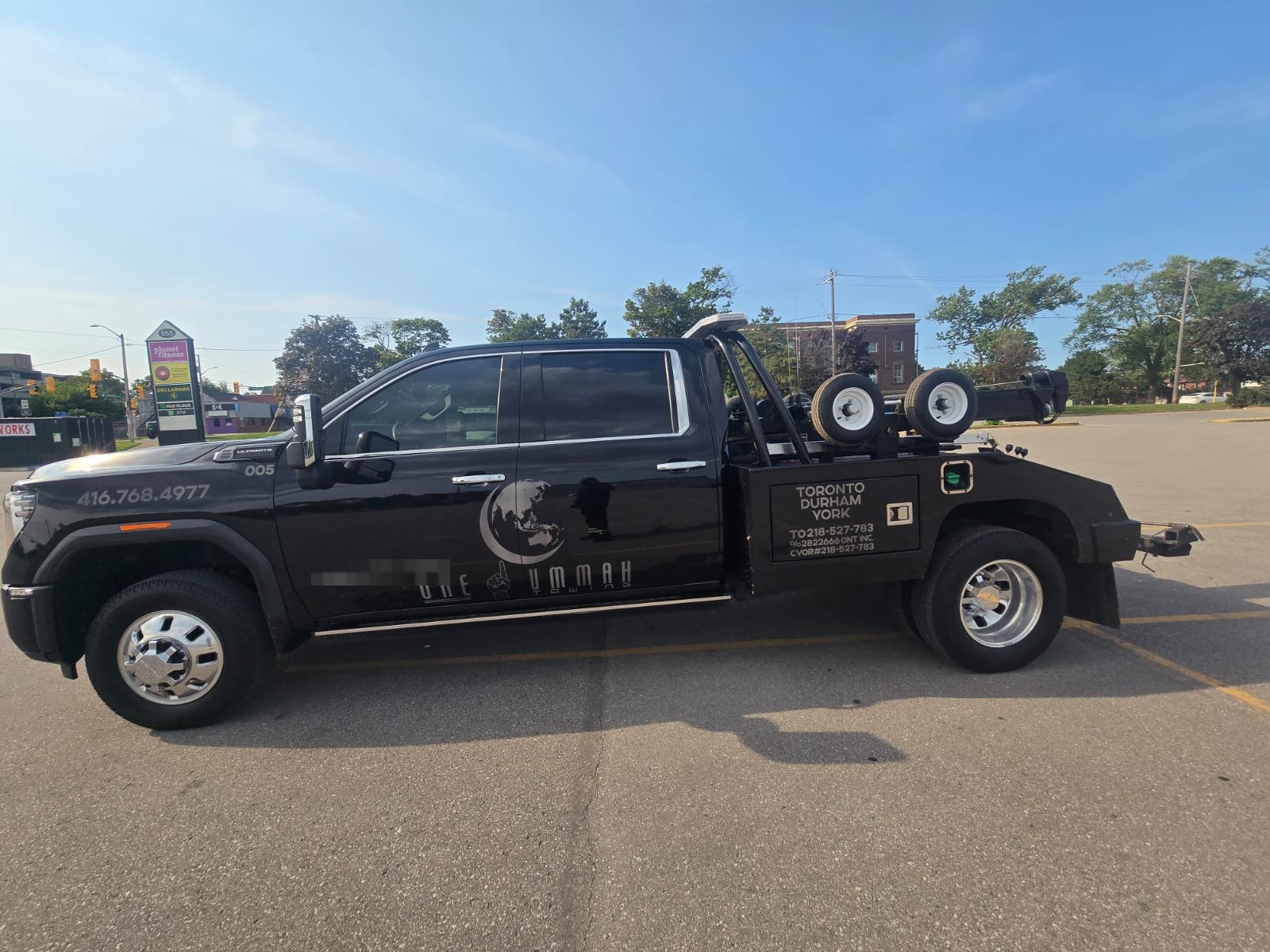 One Ummah Towing branded tow truck serving Clarington, Durham and Toronto